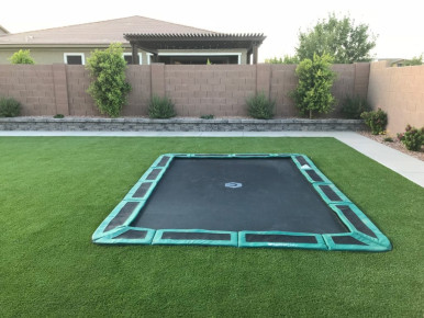 Green rectangular in-ground trampoline installers