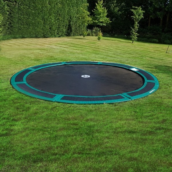 12ft Circular in-ground trampoline installed in green