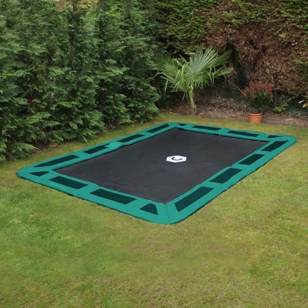 Green rectangular in-ground trampoline by Capital Play installed