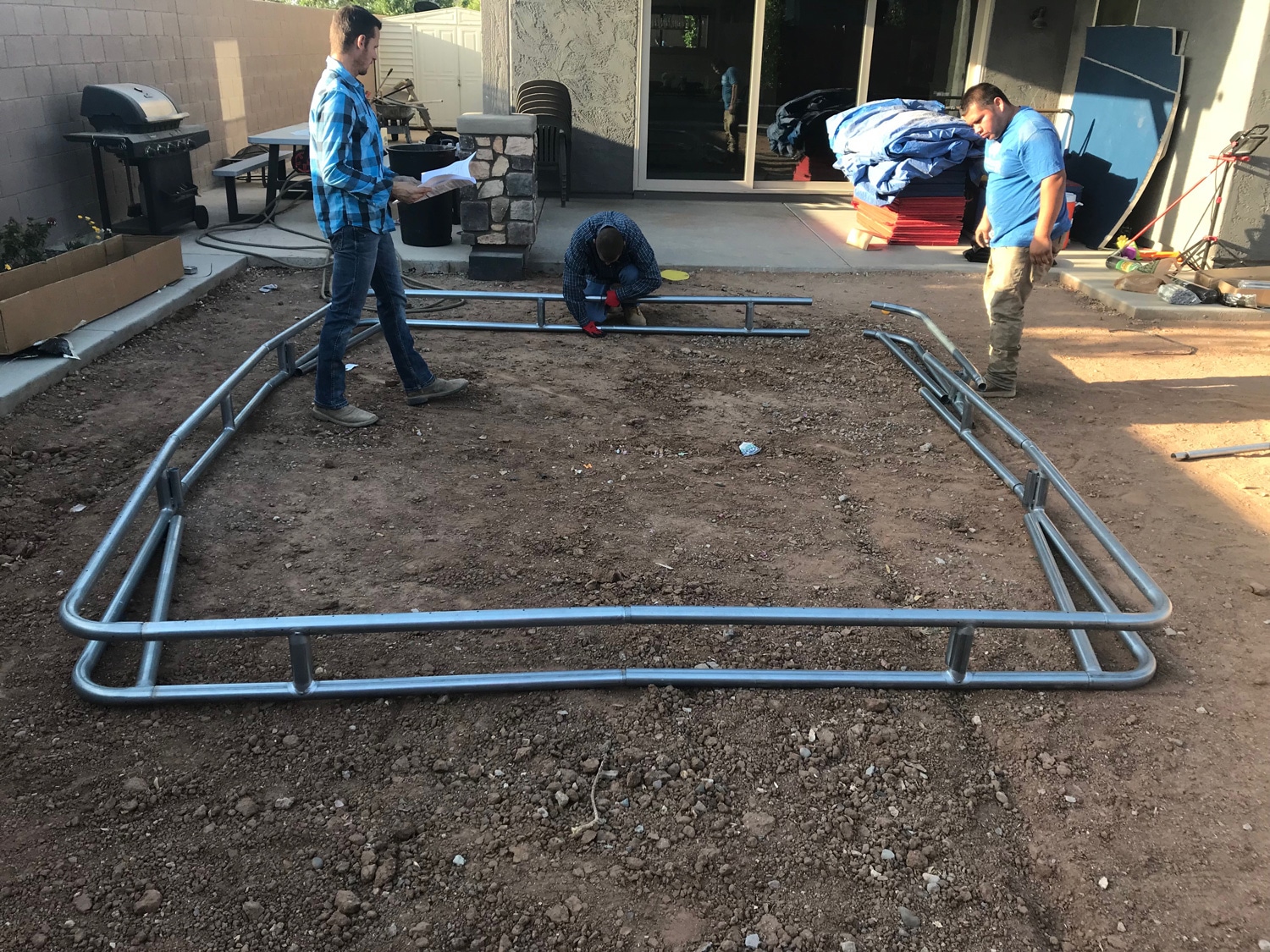 Rectangular in-ground trampoline patio steel frame placement