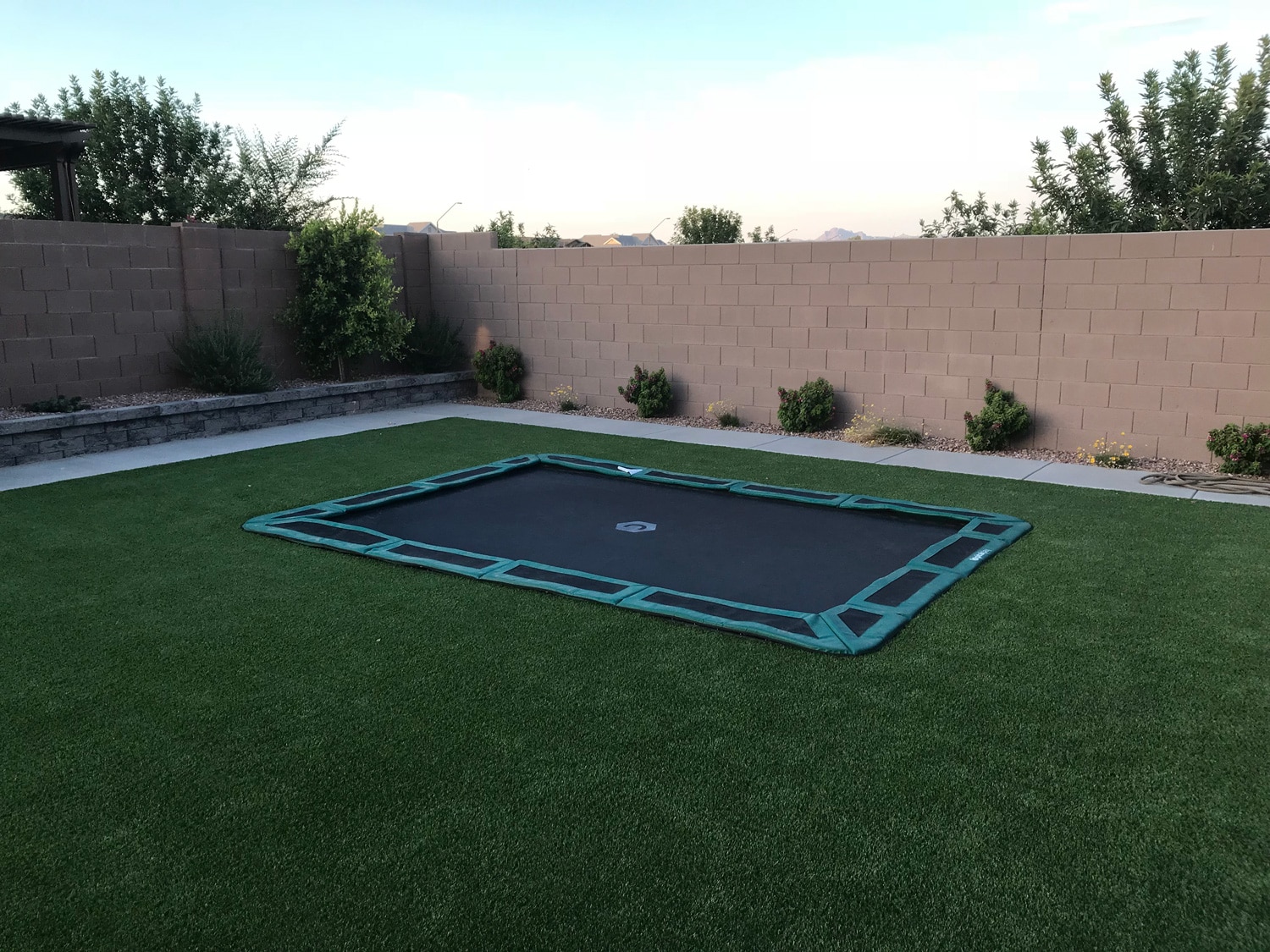 Diagonal image of The Jump Shack in-ground trampoline installed
