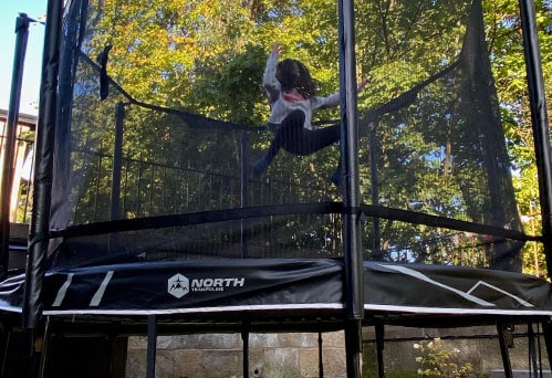 Child Jumping on a Trampoline