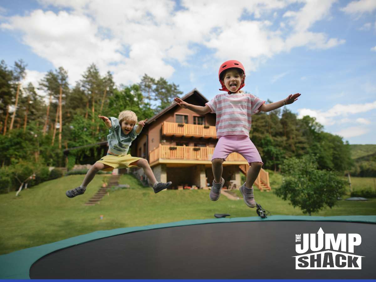 A Kid jumping in a in-ground trampoline 