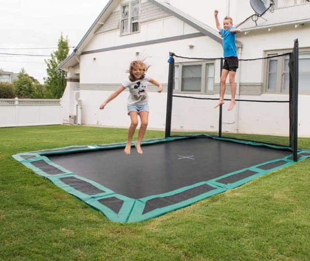 Children Playing On Inground Trampoline With One-Side Safety Net In Kansas